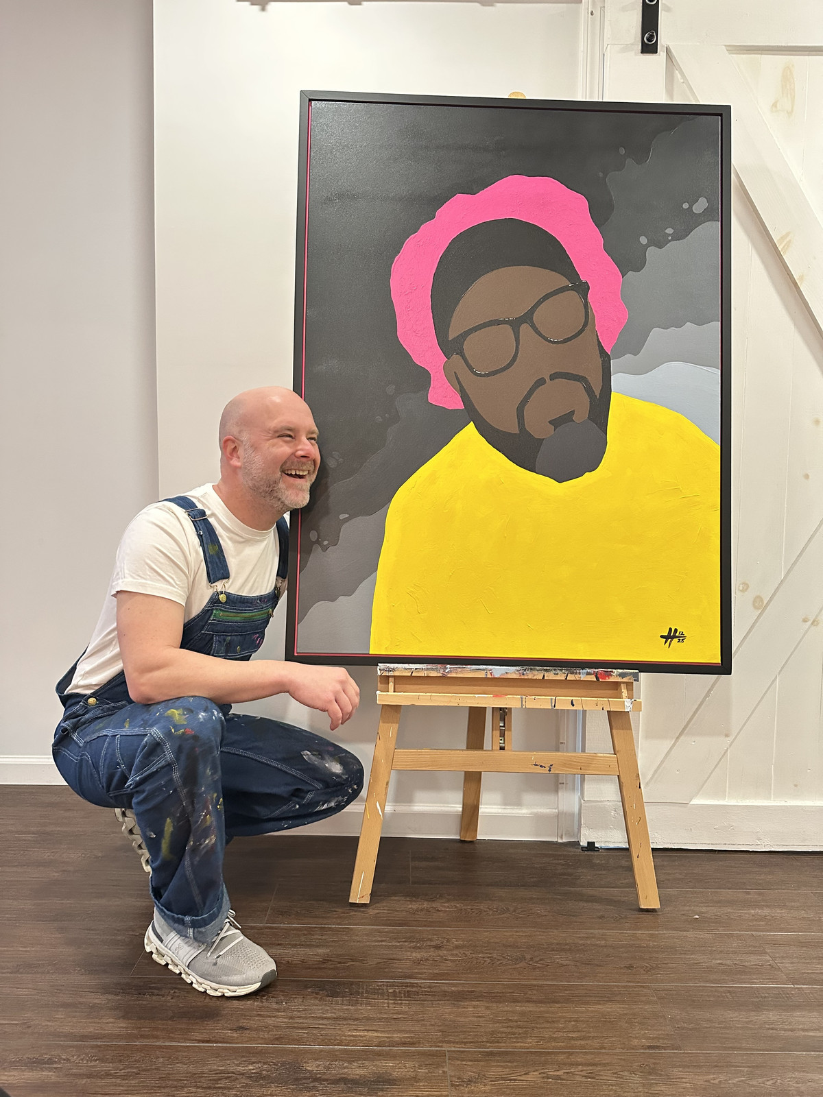 Christopher Hopper with the finished portrait Wisdom and the Looking Glass